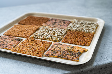 Turkish Homemade Snacks Biscuit with Sunflower Seeds, Sesame and Dill /Crispy Yaprak Galeta with Traditional Tea on Tray.