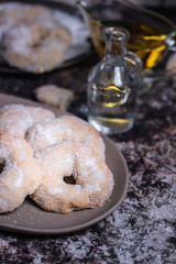A close up view of pastries with olive oil behind them