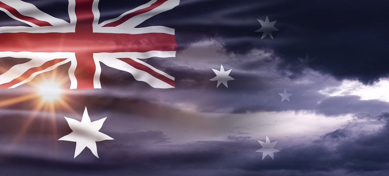 Australia National Day. Australian Flag with stripes and national colors. Background illustration. Sunset sky.