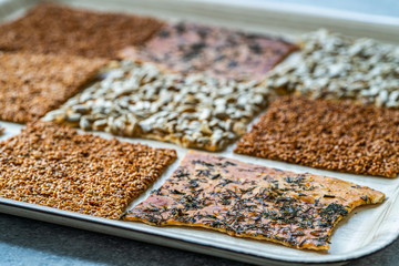 Turkish Homemade Snacks Biscuit with Sunflower Seeds, Sesame and Dill /Crispy Yaprak Galeta with Traditional Tea on Tray.