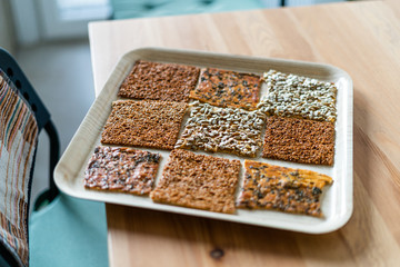 Turkish Homemade Snacks Biscuit with Sunflower Seeds, Sesame and Dill /Crispy Yaprak Galeta with Traditional Tea on Tray.