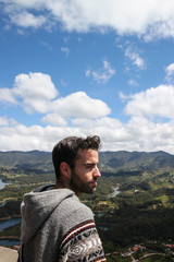 Naklejka premium Handsome man dressed as a Chilean indigenous enjoying the spring breeze