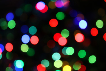 Colorful festive blurry lights of Christmas decorations
