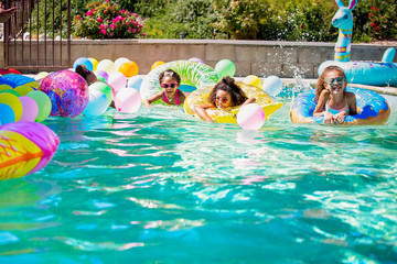 Summer fun cute girls in inflatable rings