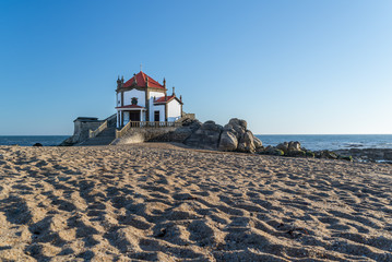 Beautiful view of Capela do Senhor da Pedra in Portugal at sunset. 