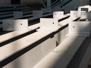 Stacked metal parts of a pre-fabricated building. Fast-built camp construction parts at the warehouse