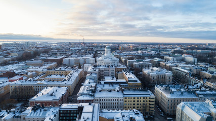 Helsinki cityscape with the Cathedral at winter evening. Top view of a crowded Christmas market at the Senate Square.