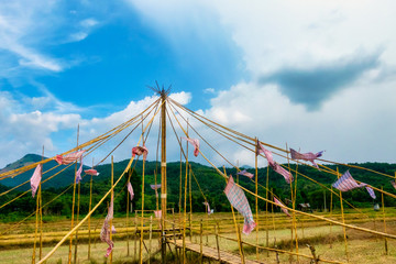 Thai bamboo walking path and bridge with beautiful sky and forrest background