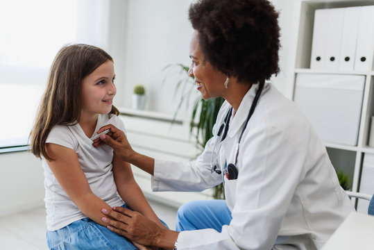 Doctor examining child with stethoscope. Respiratory disease diagnostics and treatment