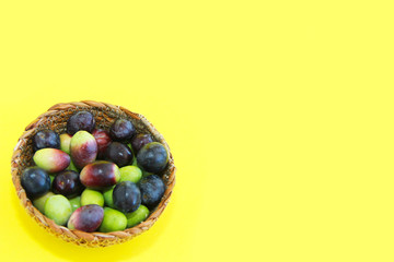 natural fresh black and burgundy olives in a decorative plate