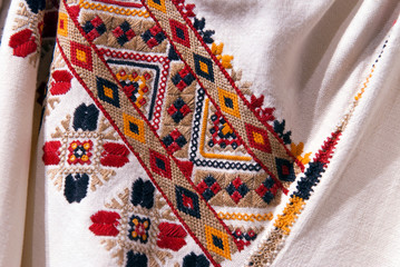 Fragment of Ukrainian national embroidery on the sleeves of the dress. Vyshyvanka - ethnic clothing...