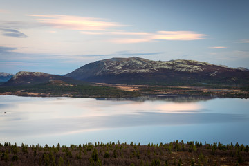Tranquil scenery during blue hour over lake an mountain top in Kvam/Norway. Peaceful landscape and outdoor concept.
