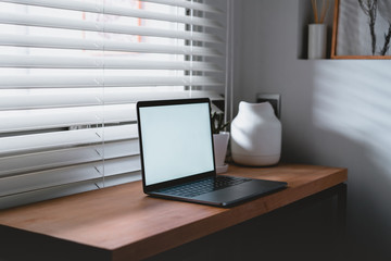 Workplace near the window with laptop and computer. Copy space. use in Traditional Chinese Alphabet operating system.