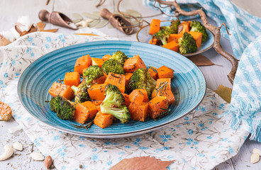 baked broccoli and pumpkin. concept of healthy and delicious food.