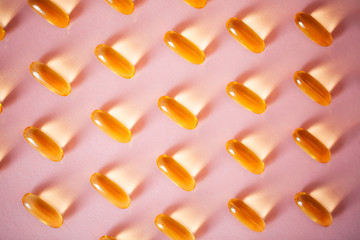 Capsules with oils for beauty. Concept of modern health-care. Flat lay style.