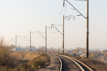 railway rails pillars wire horizon
