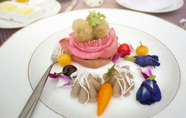 Obraz premium Tapioca pork, deletable imitation fruits, banana streamed pastry , Thai Traditional Dessert decorated with lotus flower and Butterfly pea