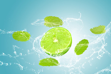 lime and mint, water splash isolated on blue background