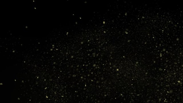 Moving Debris From Right To Left In Slow Motion In A Black Background