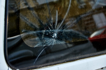 Cracked old car glass on an old car.