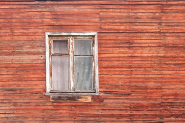 Obraz na płótnie Canvas Wall of a wooden house with window