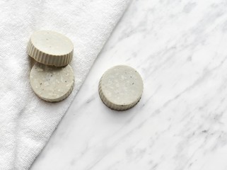 Homemade solid shampoo bars, zero waste, natural product, top view on marble background.