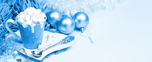 Christmas banner toned in 2020 Classic Blue. Cup of cocoa with cream and marshmallows, Christmas...