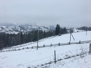 Winter mountain landscape in foggy Carpathians