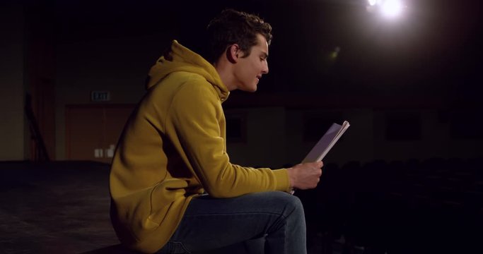 Teenagers rehearsing in a theatre