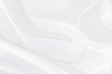White gray satin texture that is white silver fabric silk background with beautiful soft blur pattern natural.