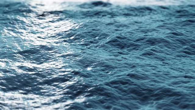 Close up of blue ocean water surface. Slow motion 4K loop