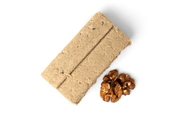 Halva and walnut isolated on white background.