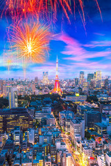 Cityscape of Tokyo, city with firework display for celebration,  aerial skyscraper view of office...