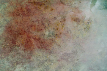 Red stained grungy background or texture