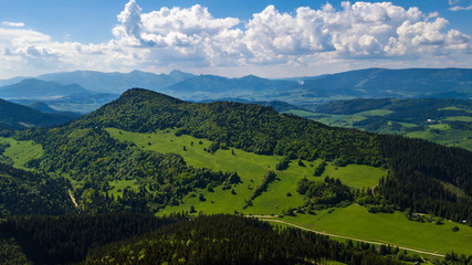 Aerial view of a green field in the Tatra Mountains in summer
