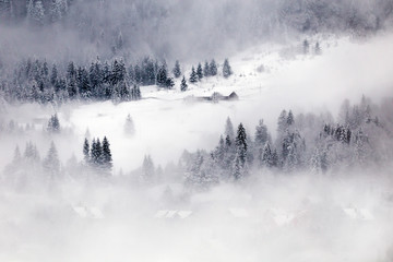 Wooden cottage in a fairy-tale winter landscape.