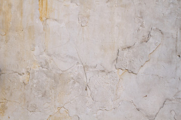 Old white wall with peeled paint