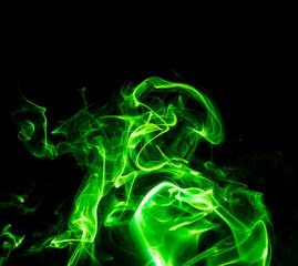 Green smoke on black background