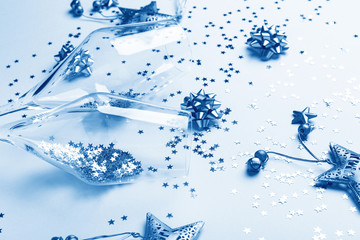 Christmas composition. Champagne glasses and decoration on paper background. Color of the year 2020...