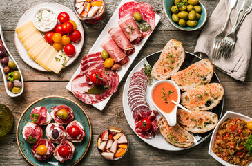 spanish tapas and sangria on wooden table, top view - obrazy, fototapety, plakaty