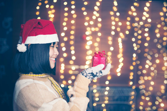 prety girl holding gift box in Christmas festival and happy new