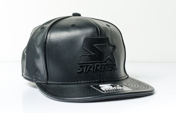 new york, usb, 05/05/2019 A black leather starter baseball cap, starter black label snap back cap, associated with hip hop and gangster fashion.urban street style isolated on a white backdrop.