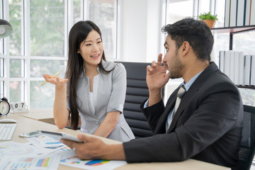 Business asian people meeting to discuss the situation on the market.