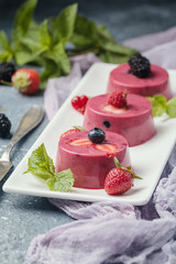 Summer dessert with berries and yogurt as a jelly pudding