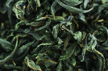 Close-up - collection of dried green tea leaves .Top view. Macro photo.