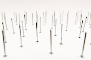 construction metal nails on white background