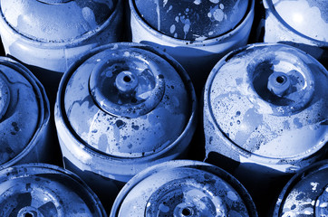 A lot of used phantom classic blue color metal tanks with paint for drawing graffiti