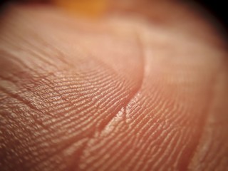 Human skin texture close up. Macro of brown young person clean skin