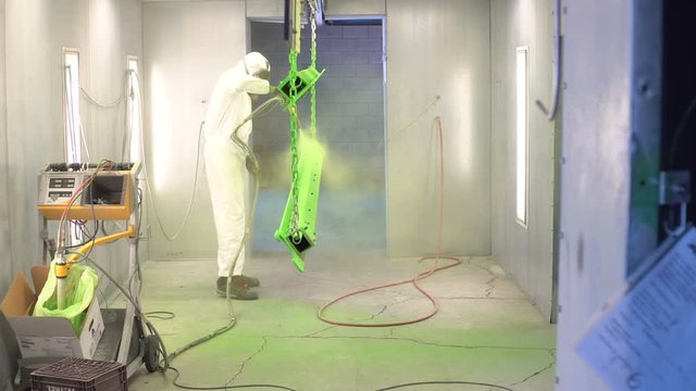 Industrial Electrostatic Powder Coating: A manufacturing process that employs charged particles to more efficiently paint a work-piece.