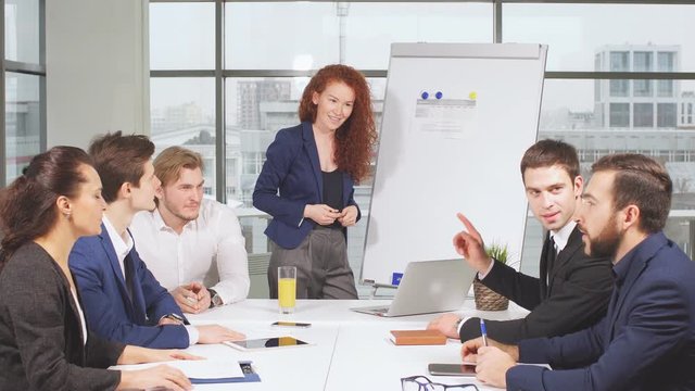 Business appointment at office space. Business woman reading out her prepositions and plans.
